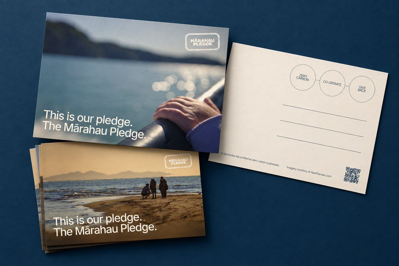 Mārahau Pledge postcards on a navy ground, front and reverse