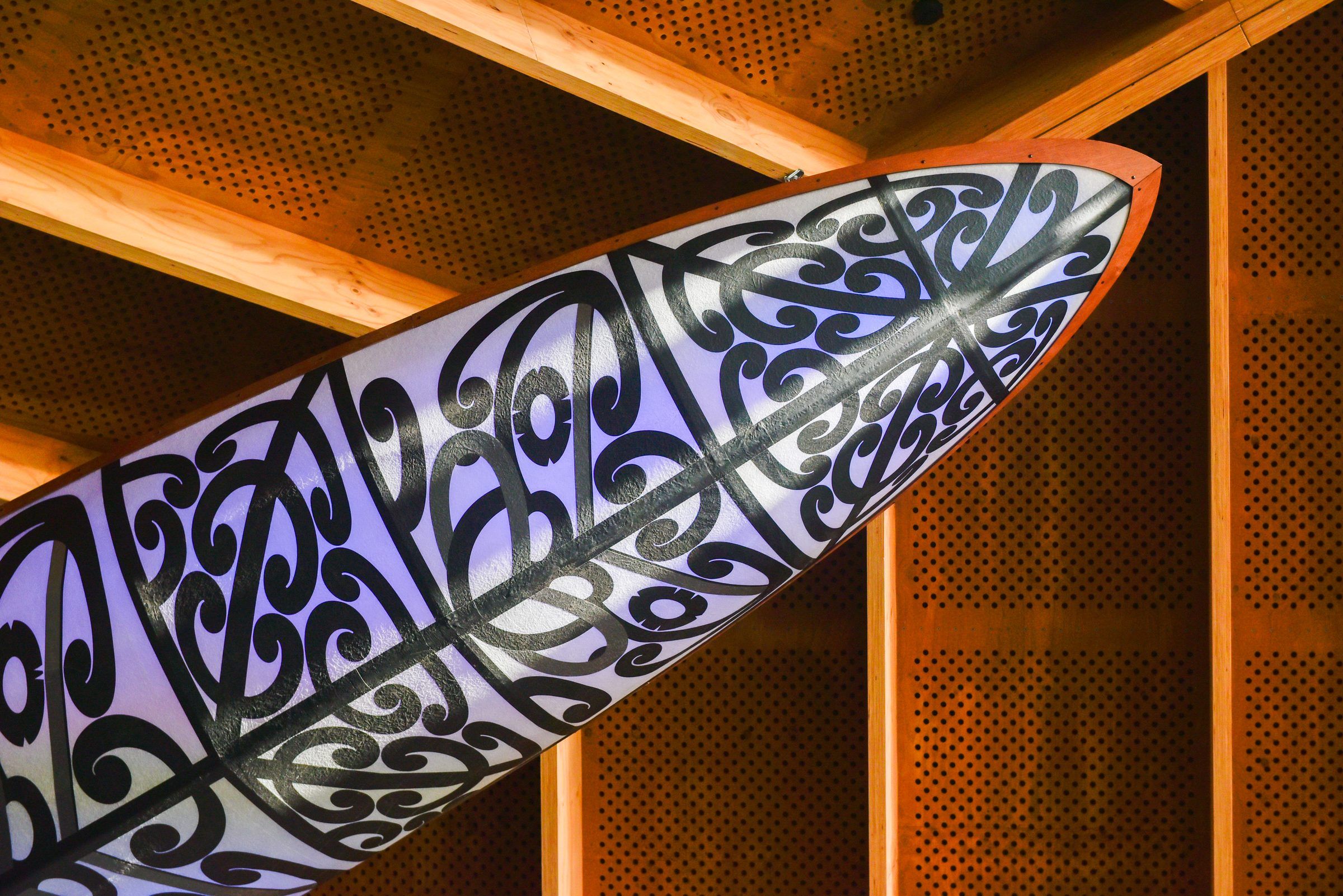 Close detail of the carved, illuminated hull of Aorere Ararau