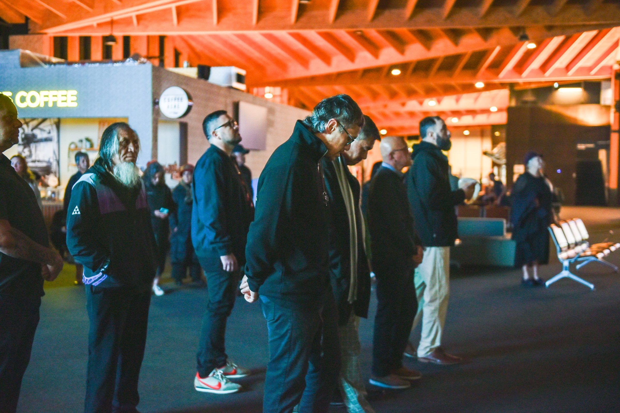 People stand together in the terminal during the dawn blessing