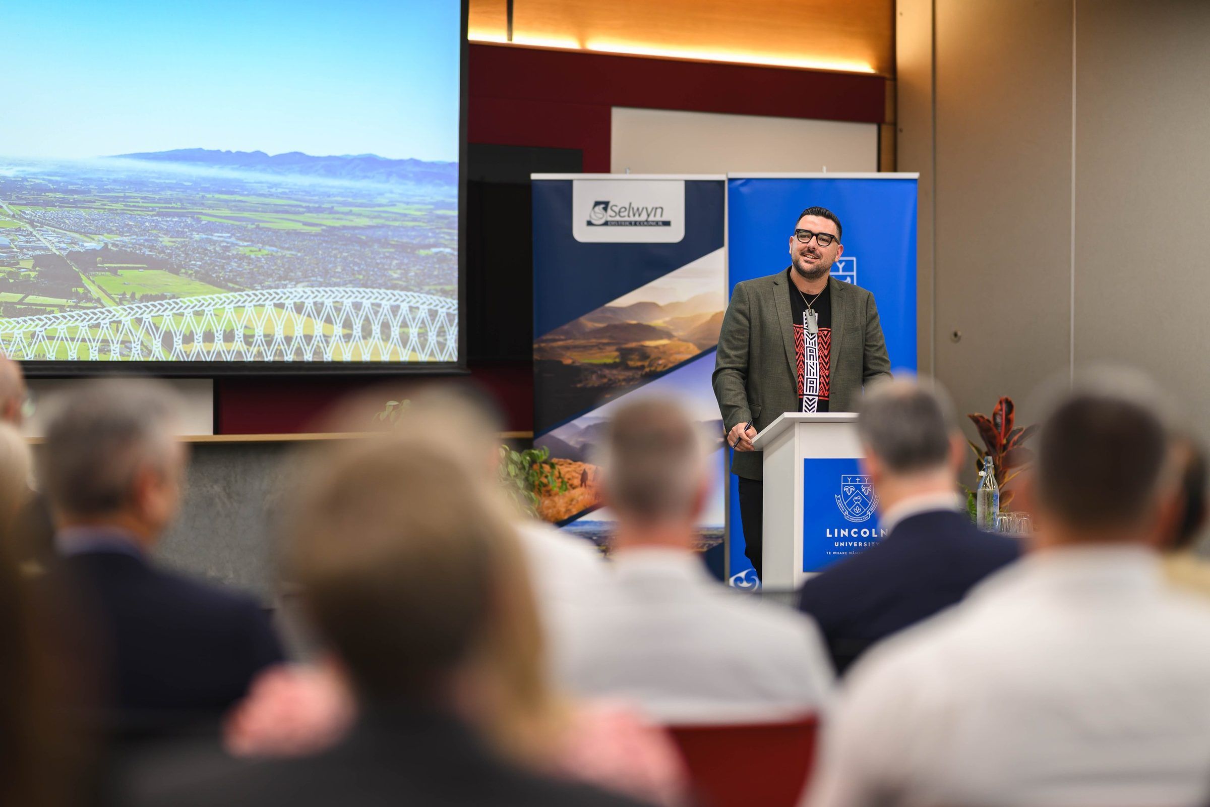 Johny O’Donnell speaks at a lectern at the launch of Selwyn’s economic development strategy