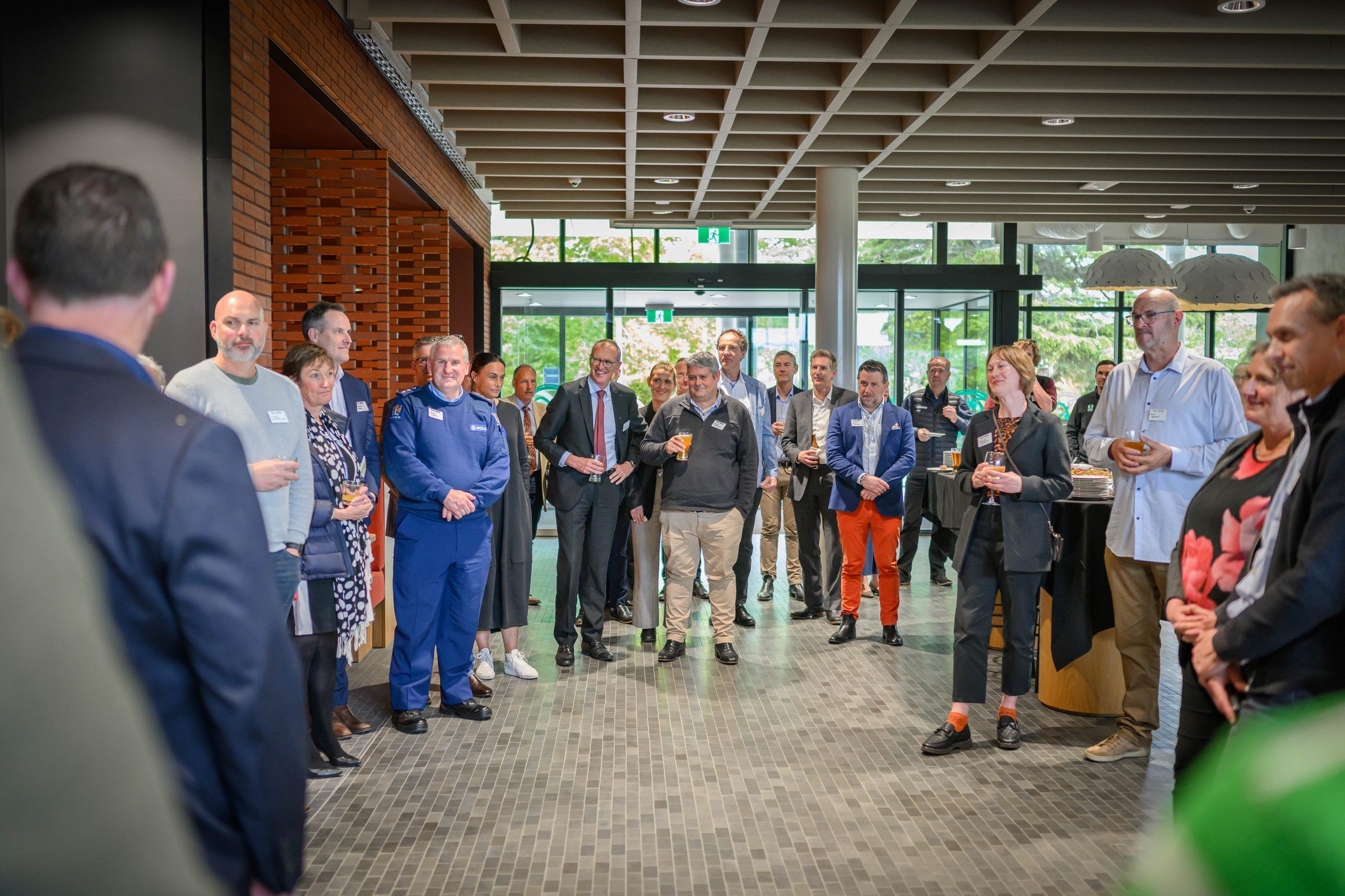 Guests stand in a circle at the strategy launch