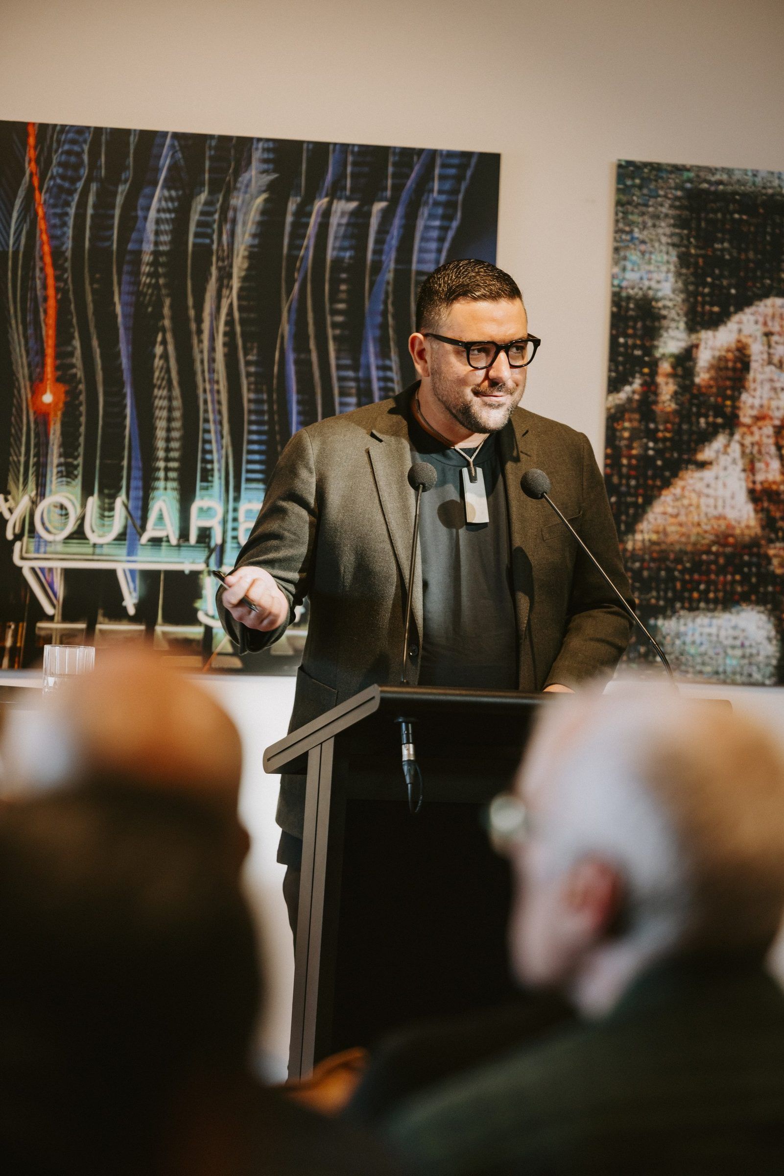 Johny O’Donnell speaks at a lectern