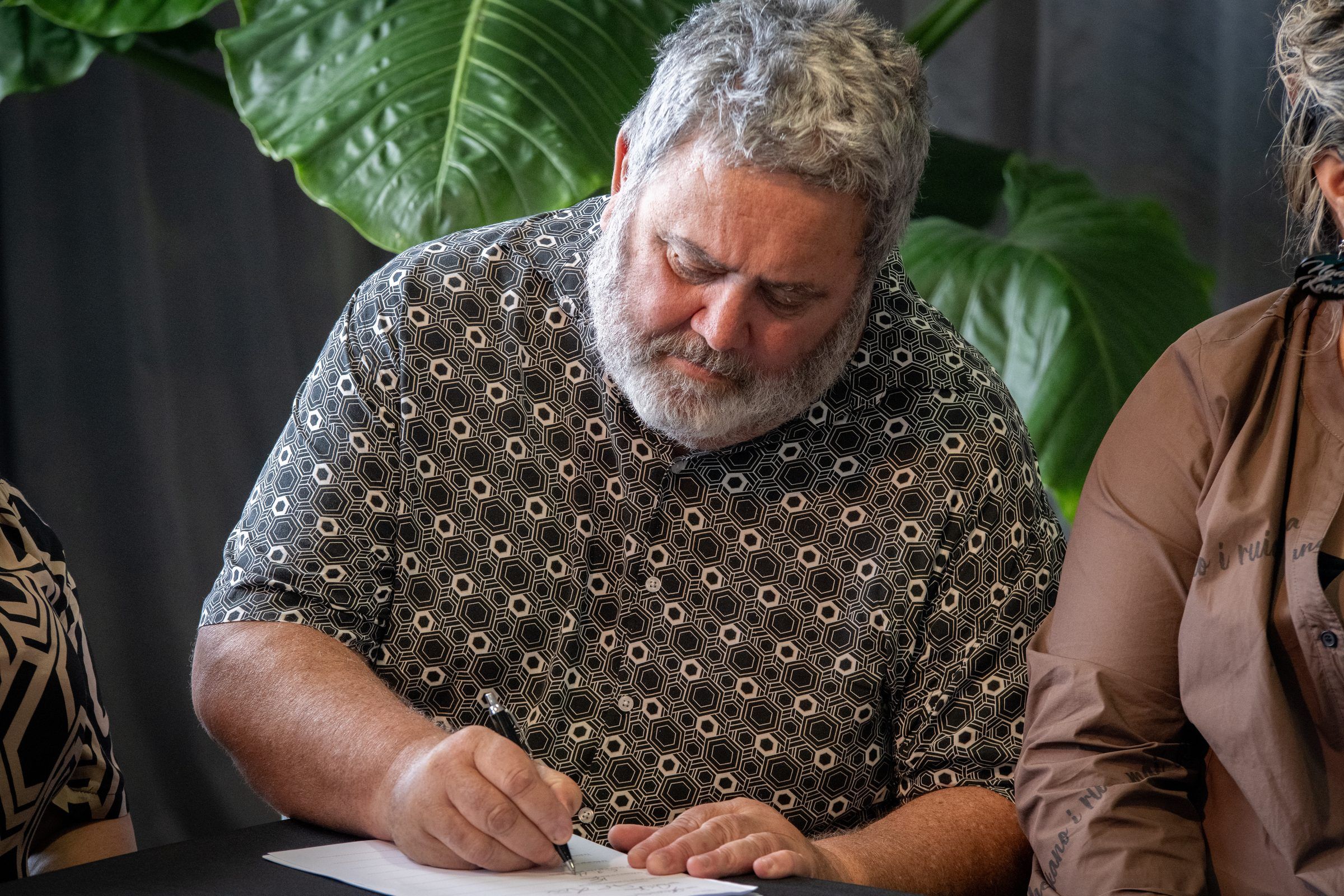 A leader signs the agreement