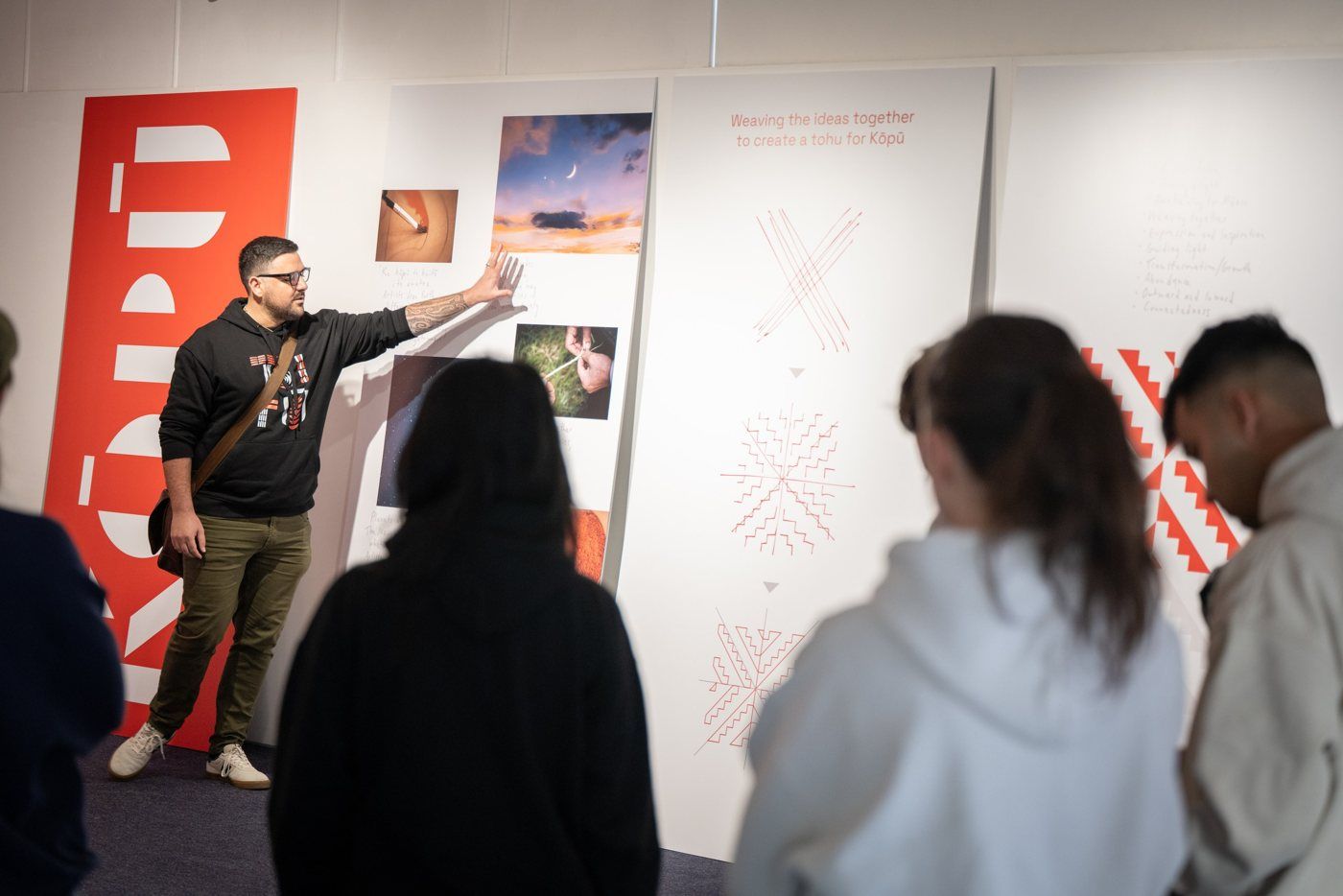 Johny O’Donnell walks a group through the story panels for Kōpū